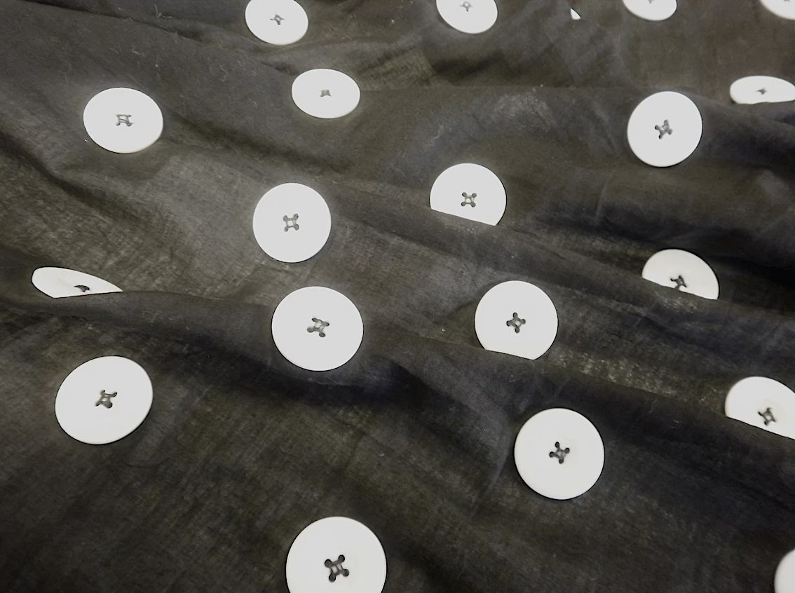 Large White Appliquéd Buttons on Black Voile