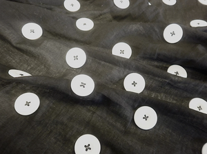 Large White Appliquéd Buttons on Black Voile