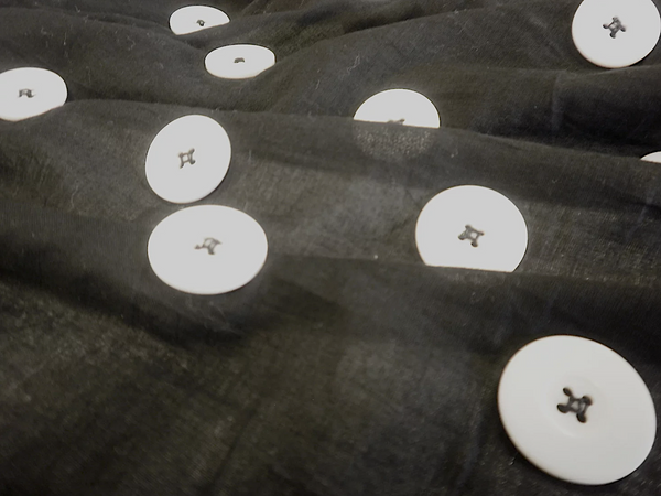 Large White Appliquéd Buttons on Black Voile