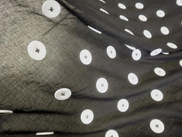 Large White Appliquéd Buttons on Black Voile