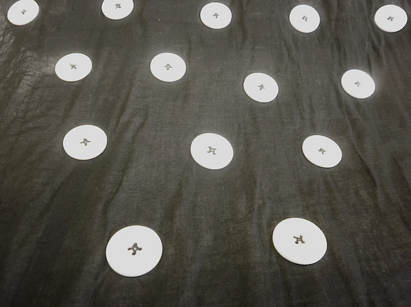 Large White Appliquéd Buttons on Black Voile